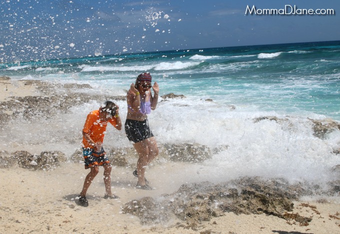 being splashed by wave