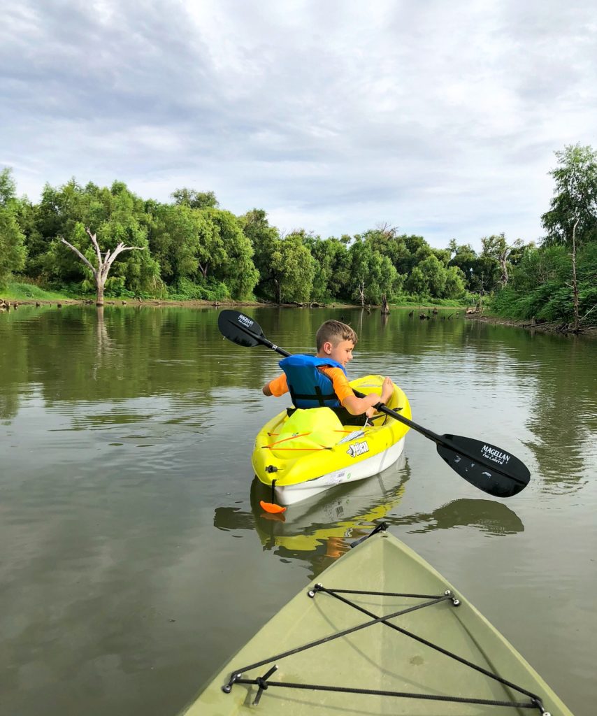 Noah kayaking the river