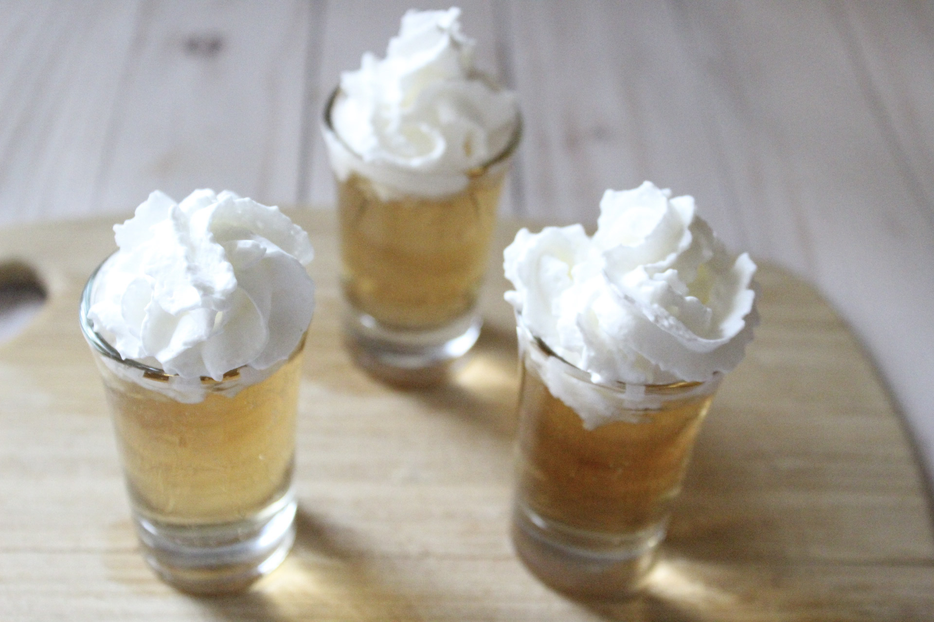 add whipped cream to top of butterbeer shots