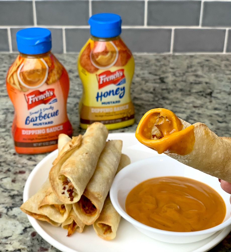 dip homemade taquito in French's barbecue mustard