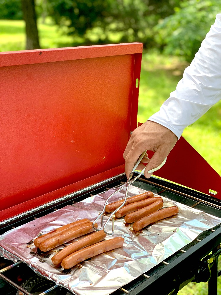 grilling hot dogs outside