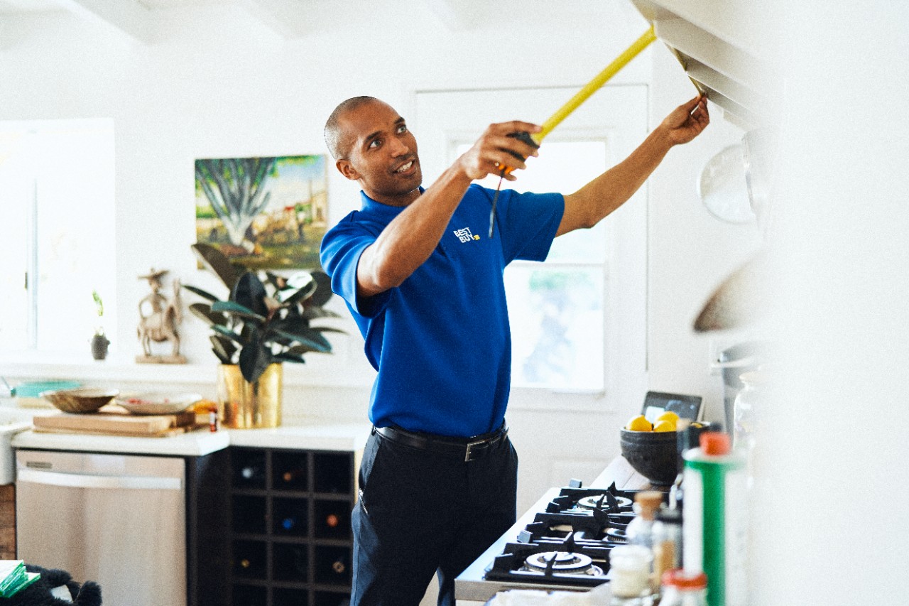 Best Buy employee helping inside home